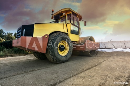 Picture of Steamroller paving a dirt road before paving